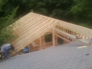 Framing a new roof addition that ties into an existing shingle roof in Meade